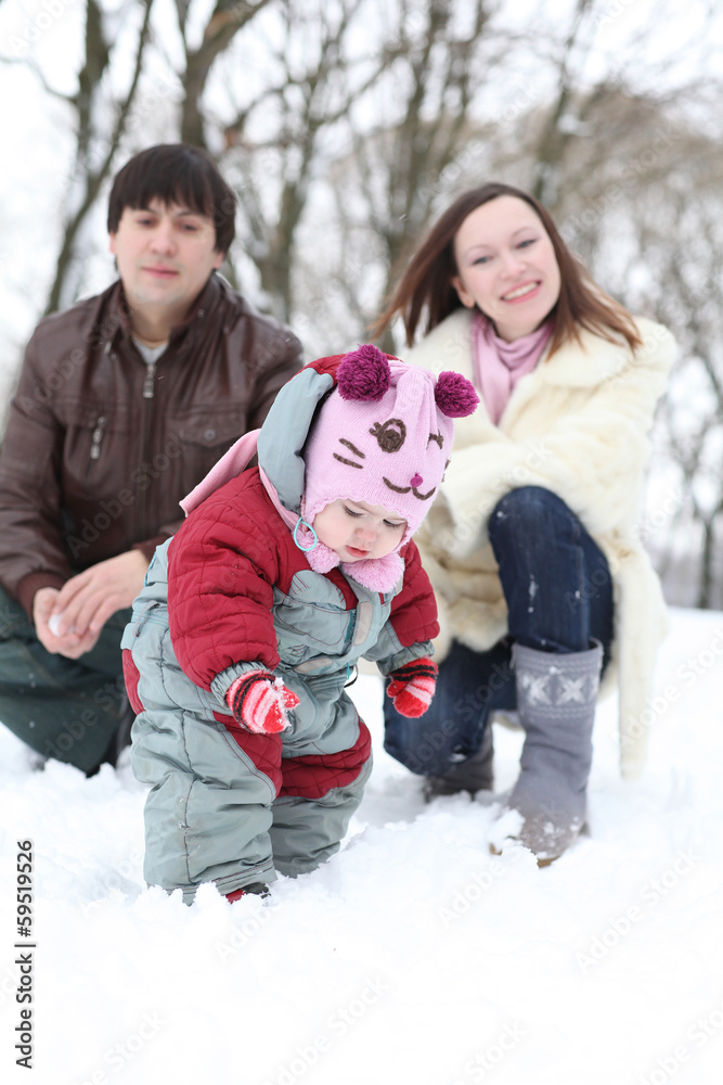 Happy family having fun on beautiful snowy