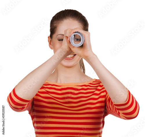 Girl looks in a folded magazine - spyglass photo