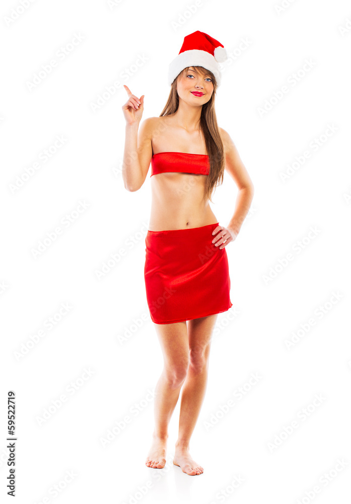 Beautiful Santa christmas girl points finger isolated on white Beautiful Santa christmas girl points finger isolated on white