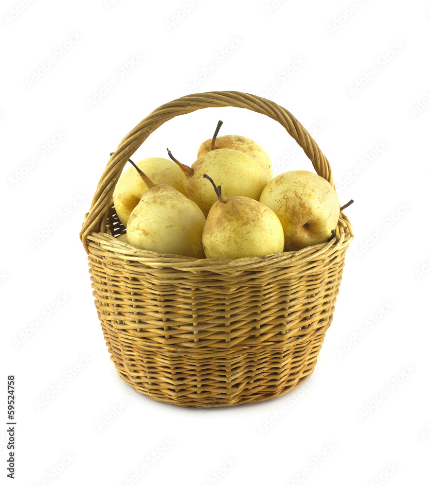 China Pears in high brown wicker basket isolated closeup China Pears in high brown wicker basket isolated closeup