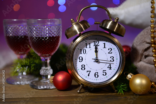 Wine glasses, retro alarm clock and Christmas decoration