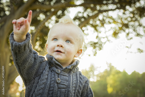 Pointing Blonde Baby Boy Outdoors at the Park.