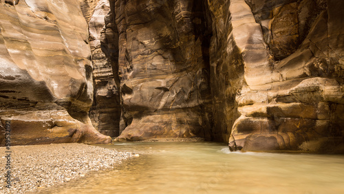 Flowing river in canyon of Wadi Mujib, Jordan photo