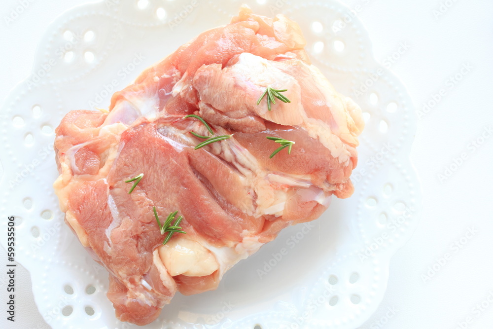 Raw chicken and rosemary