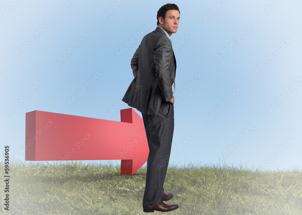Composite image of businessman with hands on hips Composite image of businessman with hands on hips