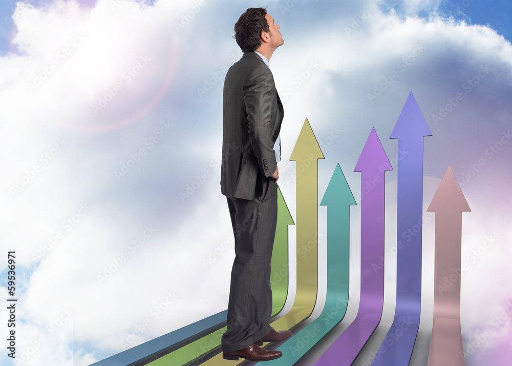 Composite image of serious businessman with hand on hip Composite image of serious businessman with hand on hip