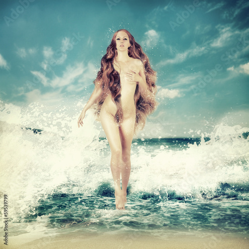 Sexy fairy woman - Aphrodite in sea waves photo