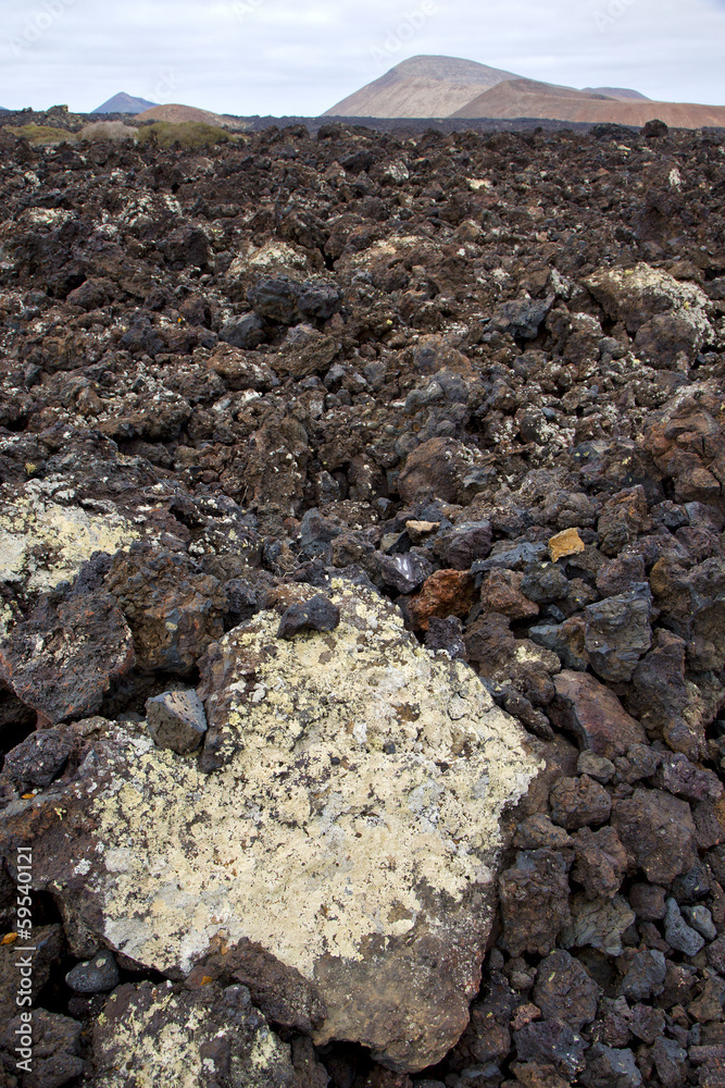 volcanic stone in los volcanes   rock  sky  hill and summer