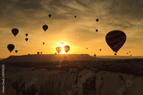 Balloons in Cappadocia at dawn sky background