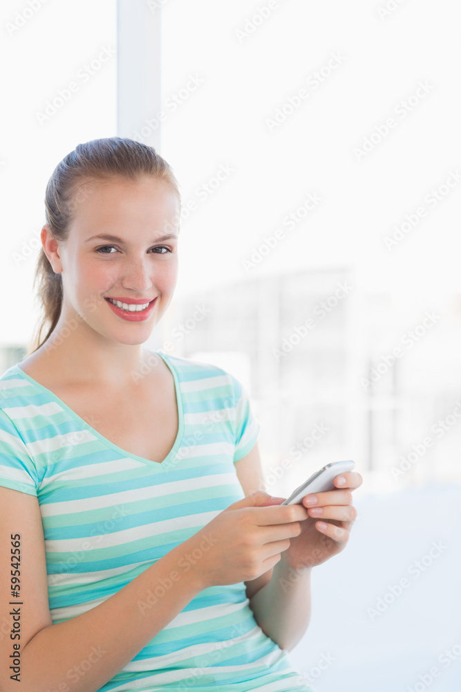 Portrait of a beautiful young woman text massaging Portrait of a beautiful young woman text massaging