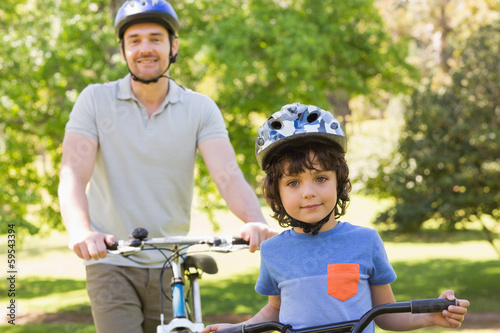 Smiling man with his son riding bicycles © WavebreakmediaMicro