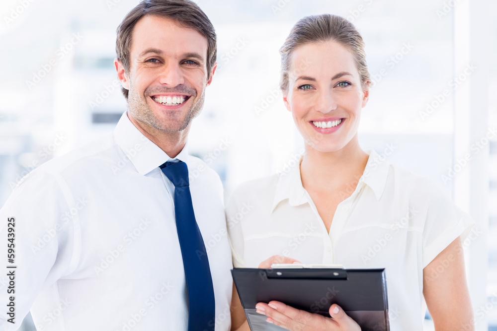 Smartly dressed colleagues using digital tablet Smartly dressed colleagues using digital tablet
