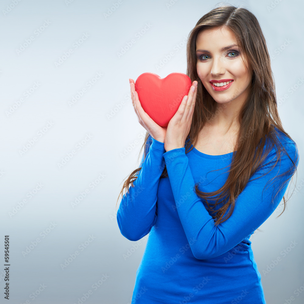 Red heart. Love symbol. Portrait of beautiful woman hold Valent Red heart. Love symbol. Portrait of beautiful woman hold Valent