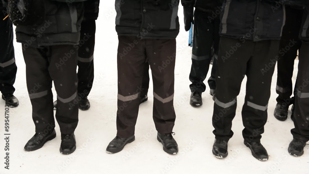 Prisoners on a walk in the winter, feet close-up Prisoners on a walk in the winter, feet close-up