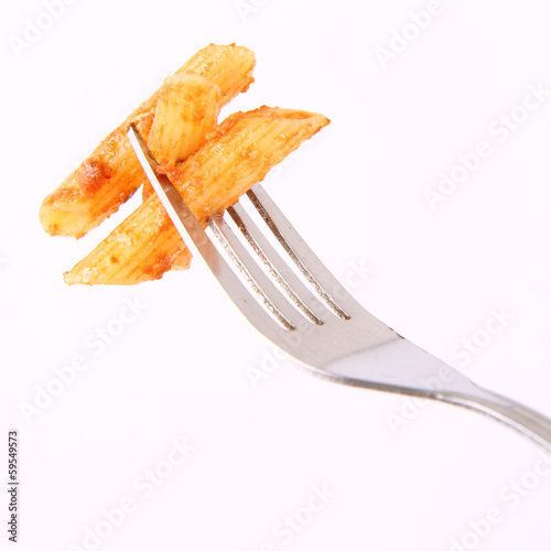 Pesto rosso on a fork on a white background