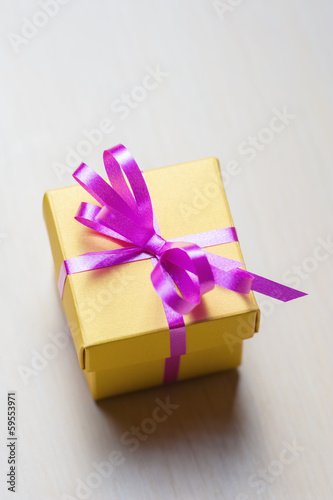 Gift box with pink ribbon