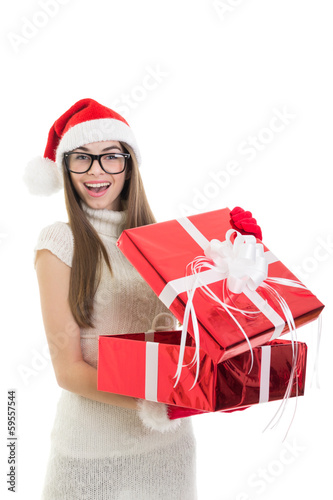 Happy teenage Santa girl opening a gift