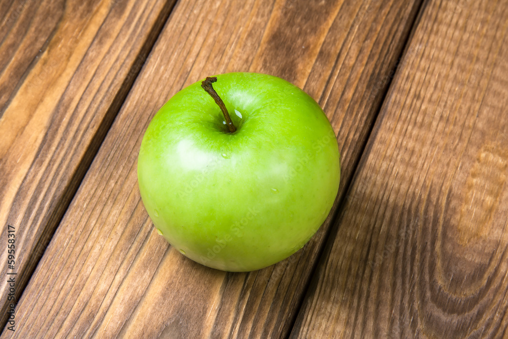 Apple on a wooden background close up Apple on a wooden background close up