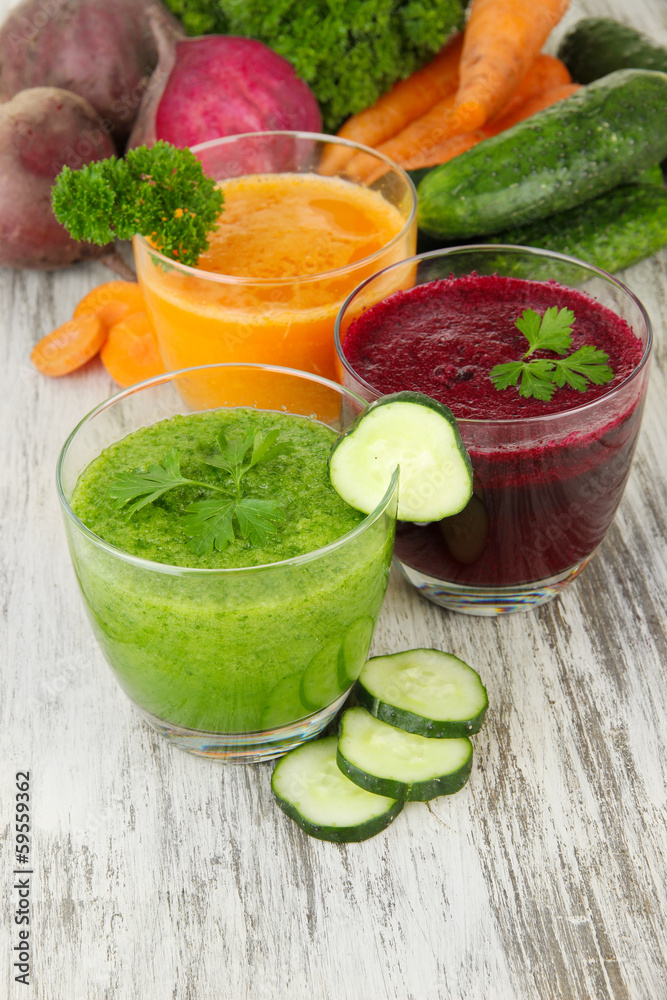 Fresh vegetable juices on table close-up Fresh vegetable juices on table close-up