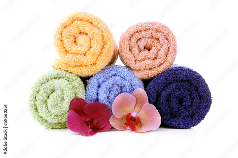 Orchid flower and towel rolls, isolated on white Orchid flower and towel rolls, isolated on white