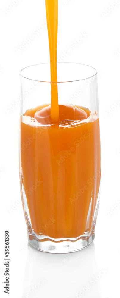 Juice pouring into glass isolated on white Juice pouring into glass isolated on white