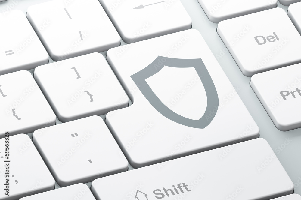 Security concept: Contoured Shield on computer keyboard Security concept: Contoured Shield on computer keyboard