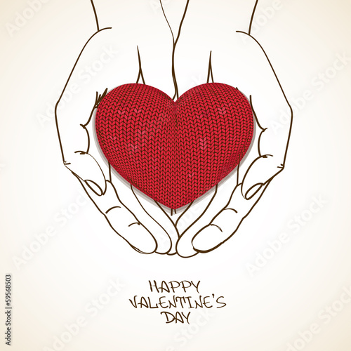 Love greeting card with human hands holding knitted heart