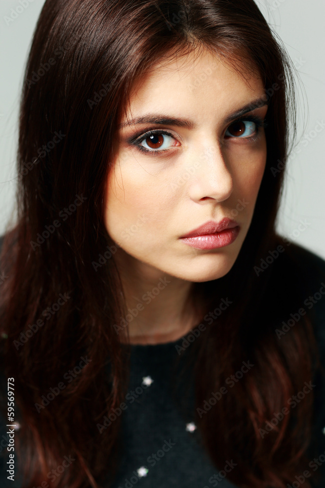 Closeup portrait of a young thoughtful woman