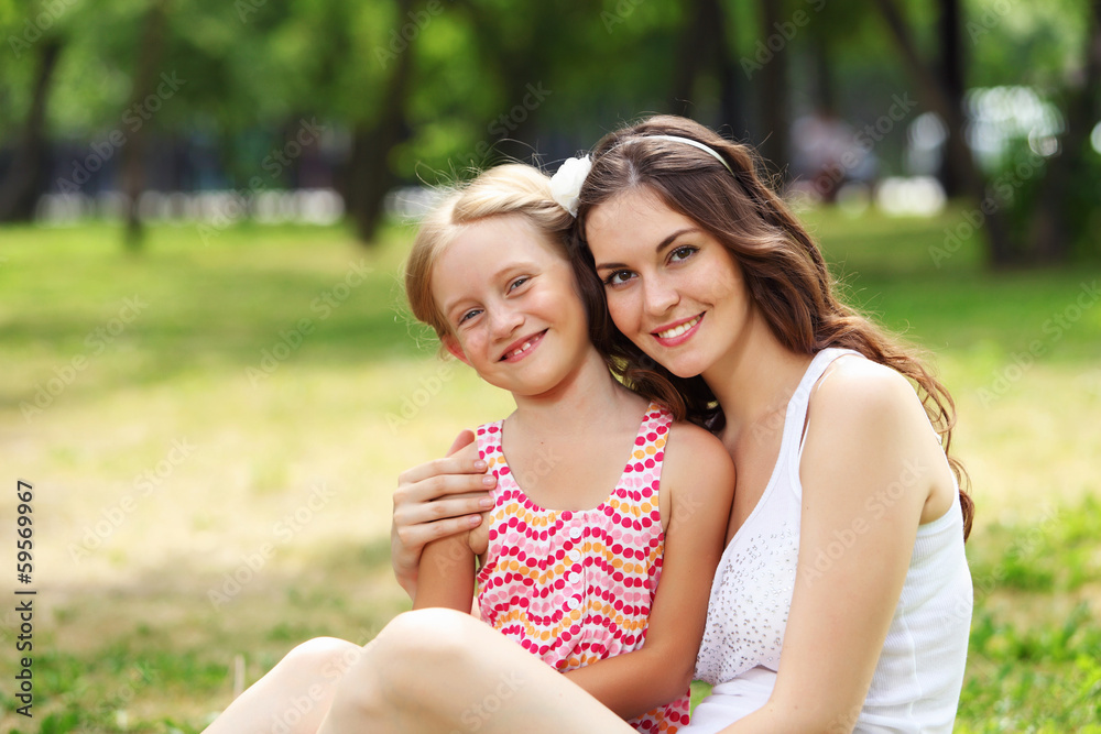 Mother and daughter in the park Mother and daughter in the park