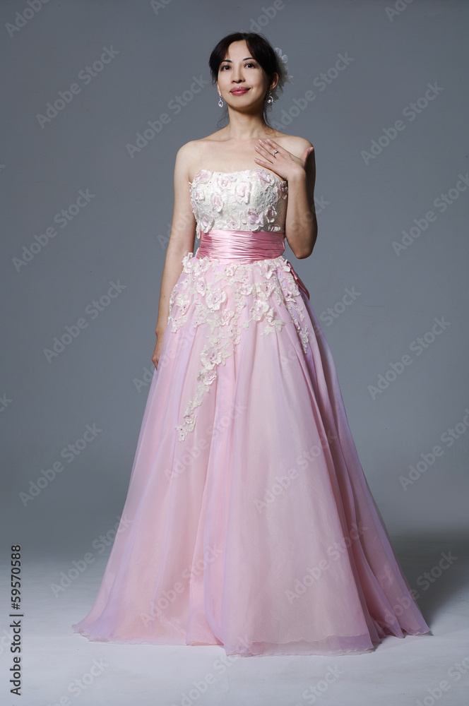 beautiful smiling girl in a white wedding dress posing beautiful smiling girl in a white wedding dress posing