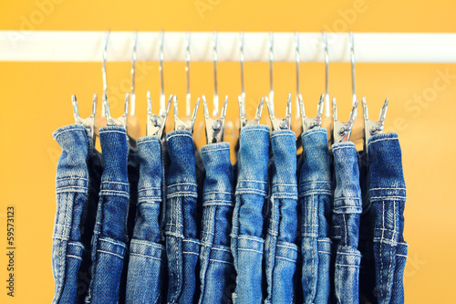 Row of hanged blue jeans