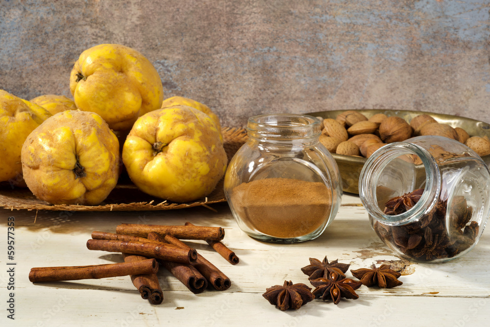 quinces, anise and cinamon on wooden table quinces, anise and cinamon on wooden table