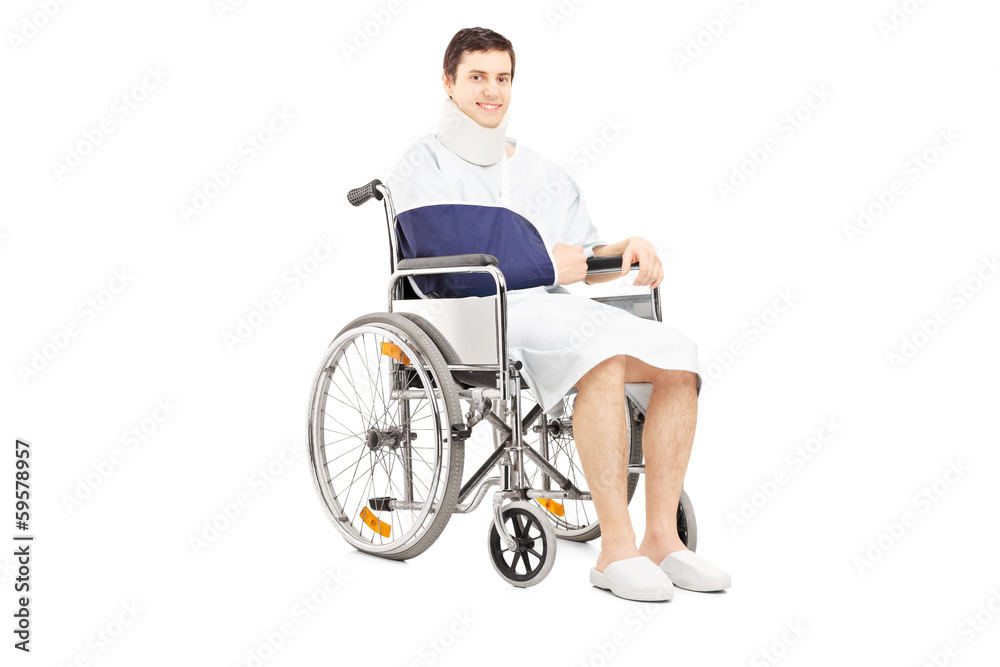 Disabled male patient with broken arm posing in a wheelchair Disabled male patient with broken arm posing in a wheelchair