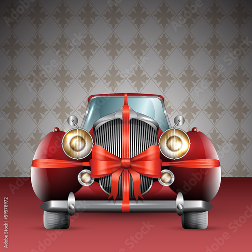 Vintage red car tied with red bow