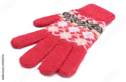 Red woolen glove on white background