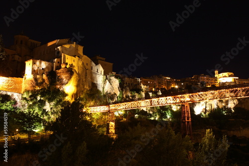 Night view on rocky river bank Jucar and bridge in Cuenca. Casti