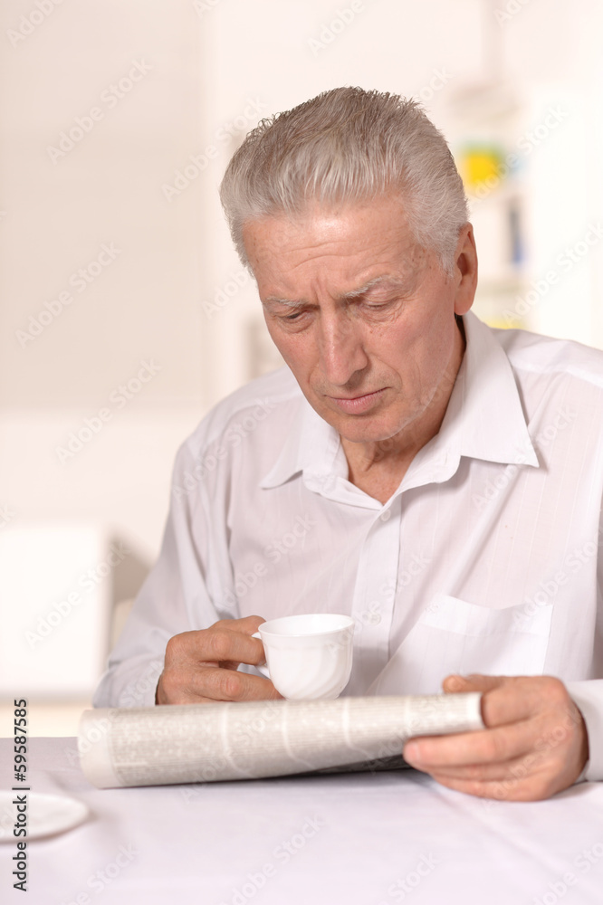 Senior man with newspaper Senior man with newspaper