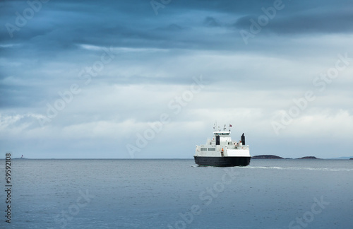 Canvas Print White passenger ferry in overcast weather in Norwegian sea
