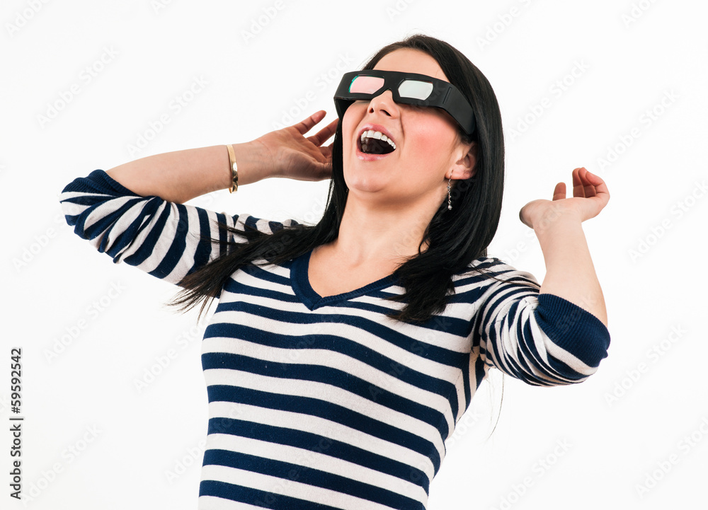 Young girl is shocked to watch a movie with 3D glasses, making i Young girl is shocked to watch a movie with 3D glasses, making i