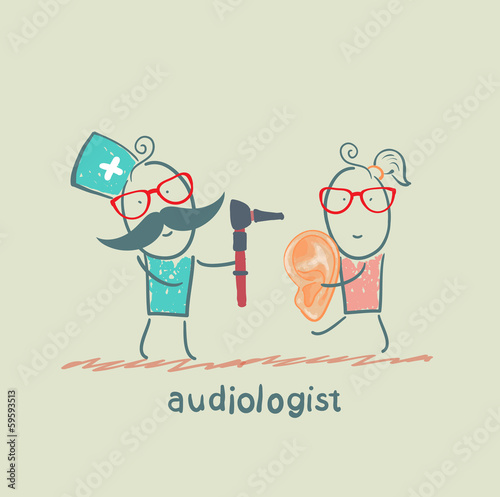 otolaryngologist  stands next to the patient who holds a large ear