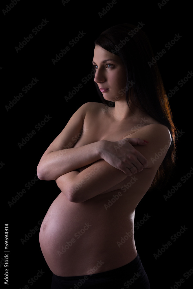 naked pregnant woman isolated on black Stock Photo | Adobe Stock