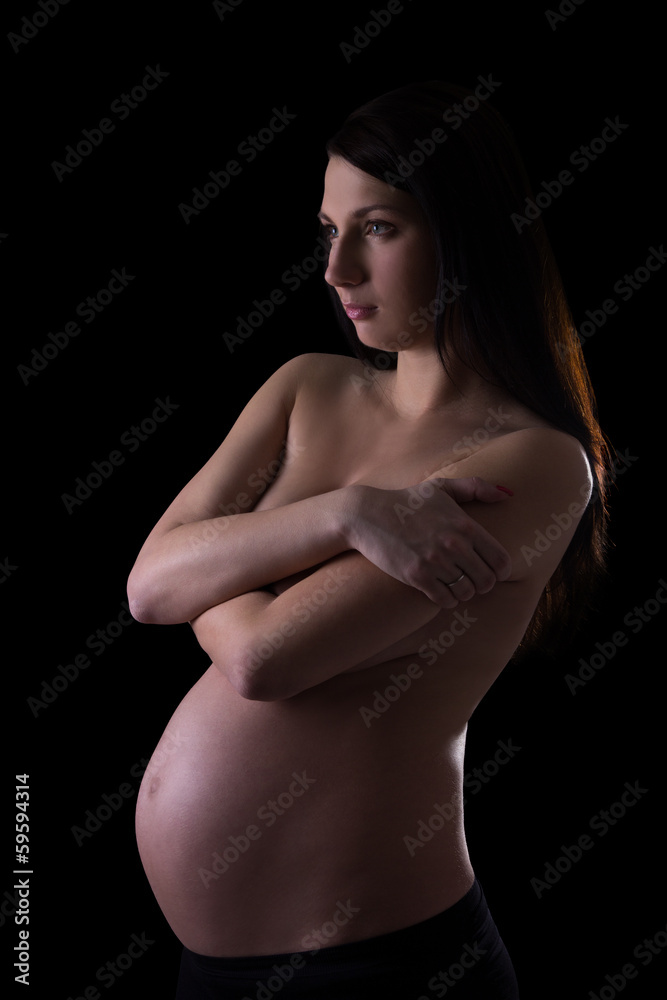 naked pregnant woman isolated on black naked pregnant woman isolated on black