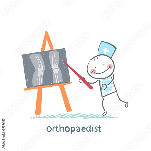 orthopaedist shows an X-ray