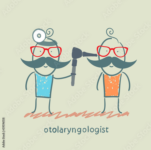 otolaryngologist examines the patient's ear