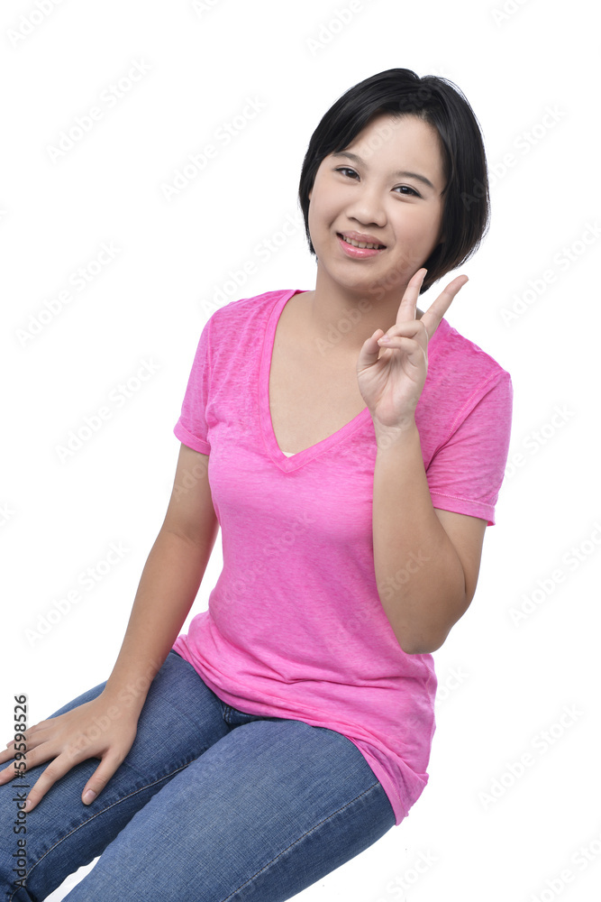 Sensual young woman sitting on the cube. Studio shot Sensual young woman sitting on the cube. Studio shot