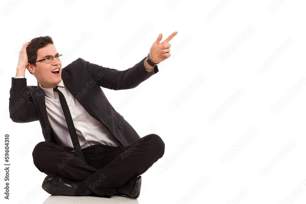 Shocked office worker pointing at the air. Shocked office worker pointing at the air.