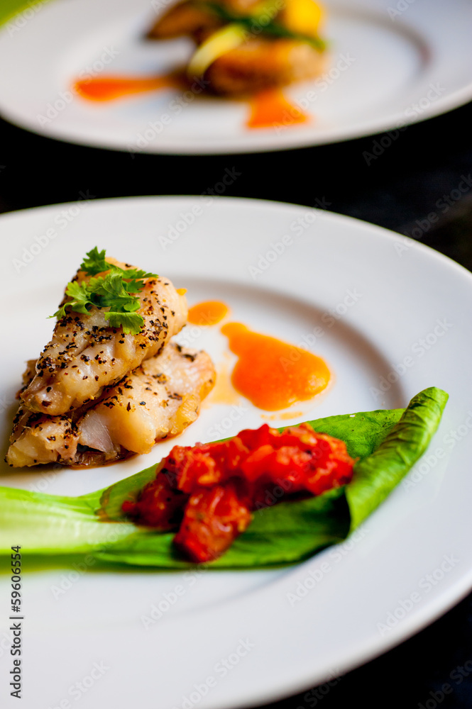 Yellow tail fillet, carrot puree and braised bak choy and tomato Yellow tail fillet, carrot puree and braised bak choy and tomato