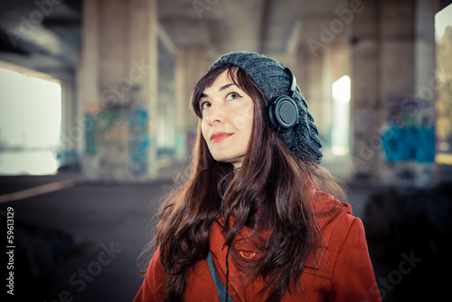 beautiful woman red coat listening music