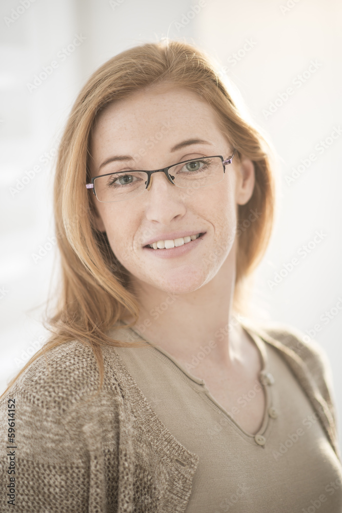 closeup of a beautiful smiling woman with glasses closeup of a beautiful smiling woman with glasses