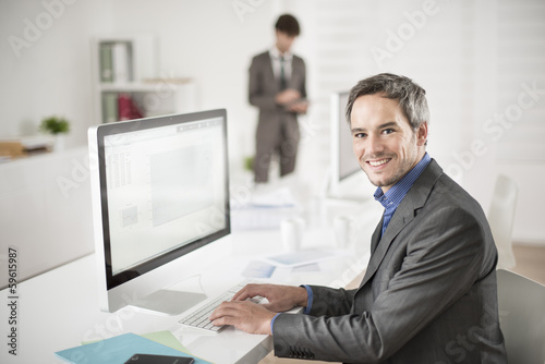 businessman works on computer at his office
